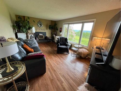 6800 100 Avenue, Peace River, AB - Indoor Photo Showing Living Room With Fireplace