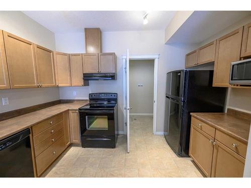 C104-8640 103 Avenue, Grande Prairie, AB - Indoor Photo Showing Kitchen