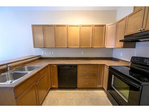 C104-8640 103 Avenue, Grande Prairie, AB - Indoor Photo Showing Kitchen With Double Sink