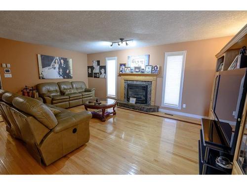 710049 71 Range, Rural Grande Prairie No. 1, County Of, AB - Indoor Photo Showing Living Room With Fireplace