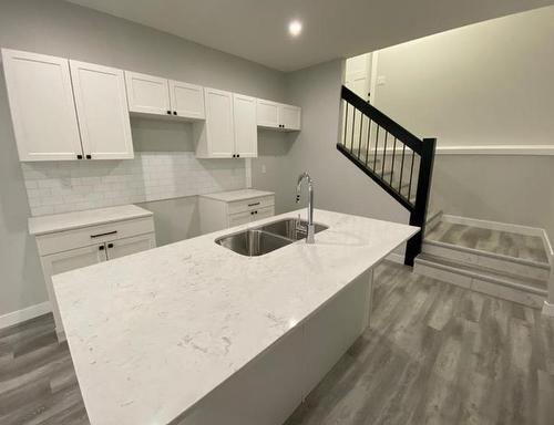 12902 102A Street, Grande Prairie, AB - Indoor Photo Showing Kitchen With Double Sink