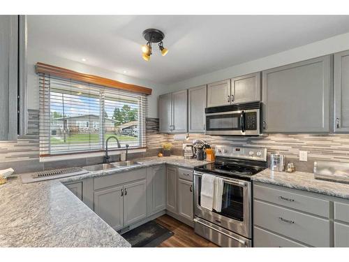 11421 107 Avenue, Fairview, AB - Indoor Photo Showing Kitchen With Stainless Steel Kitchen With Double Sink