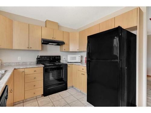 101-105, 201-205, 301-305-9225 93 Avenue, Grande Prairie, AB - Indoor Photo Showing Kitchen With Double Sink