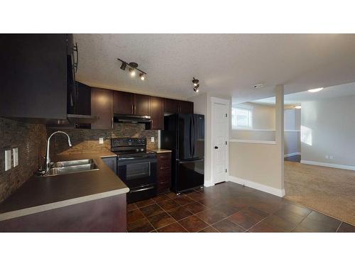 9302 100 Avenue, Grande Prairie, AB - Indoor Photo Showing Kitchen With Double Sink