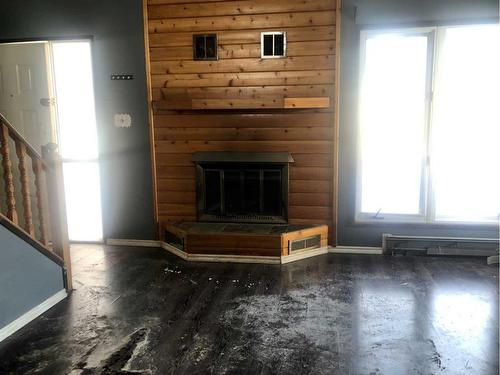 10507 105 Street, High Level, AB - Indoor Photo Showing Living Room With Fireplace