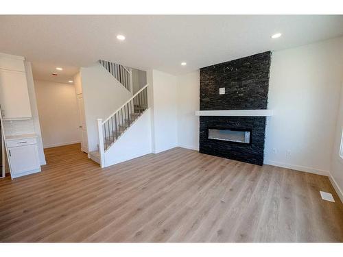 12838 87A Street, Grande Prairie, AB - Indoor Photo Showing Living Room With Fireplace