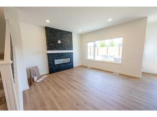 12838 87A Street, Grande Prairie, AB - Indoor Photo Showing Living Room With Fireplace