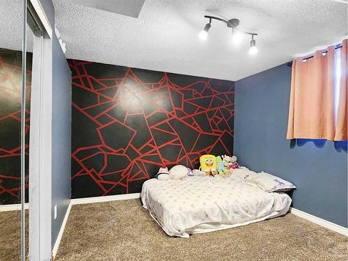 11083 Swann Drive, Grande Cache, AB - Indoor Photo Showing Bedroom