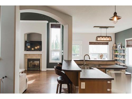 8605 70 Avenue, Grande Prairie, AB - Indoor Photo Showing Kitchen With Fireplace With Double Sink