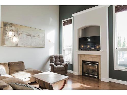 8605 70 Avenue, Grande Prairie, AB - Indoor Photo Showing Living Room With Fireplace