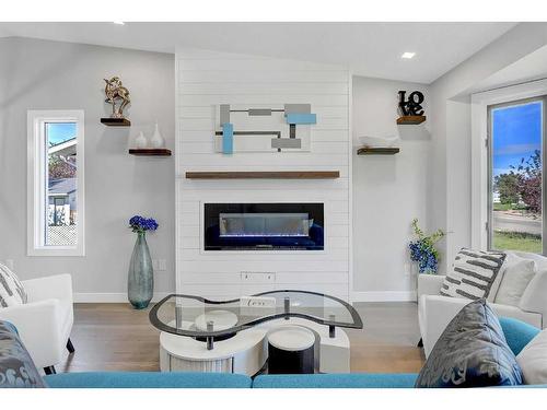 8214 Mission Heights Drive, Grande Prairie, AB - Indoor Photo Showing Living Room With Fireplace