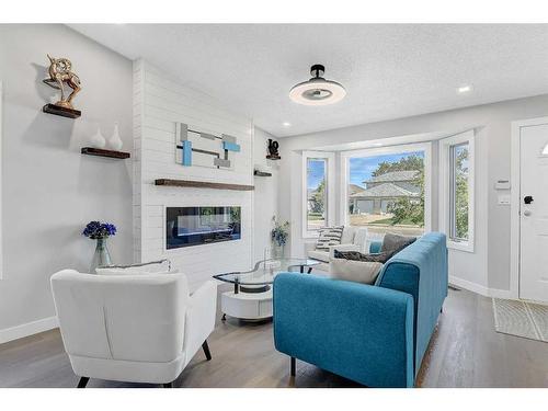 8214 Mission Heights Drive, Grande Prairie, AB - Indoor Photo Showing Living Room With Fireplace