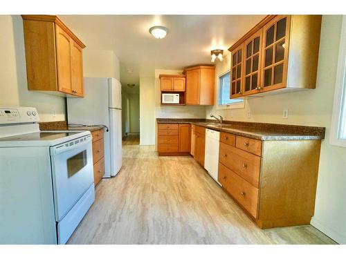 10812 103A Street, Peace River, AB - Indoor Photo Showing Kitchen With Double Sink