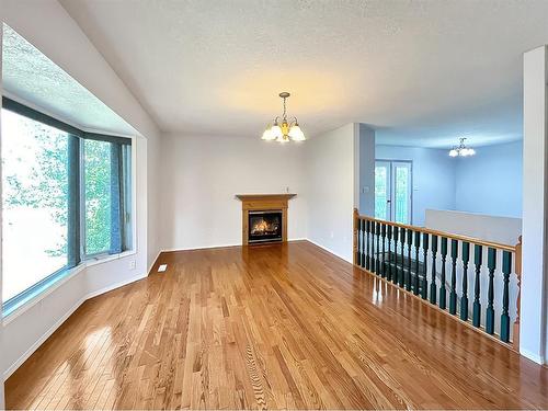 101 1St Avenue Ne, Mclennan, AB - Indoor Photo Showing Living Room With Fireplace