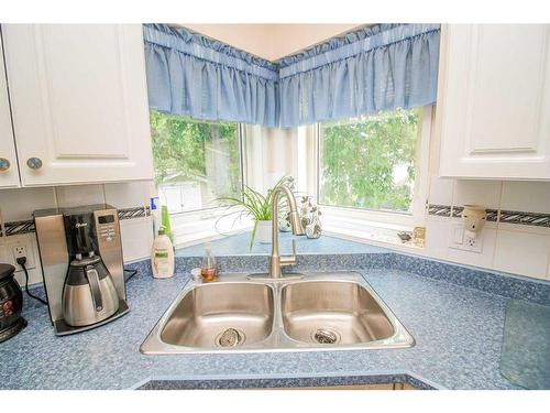 7509 102 Street, Grande Prairie, AB - Indoor Photo Showing Kitchen With Double Sink