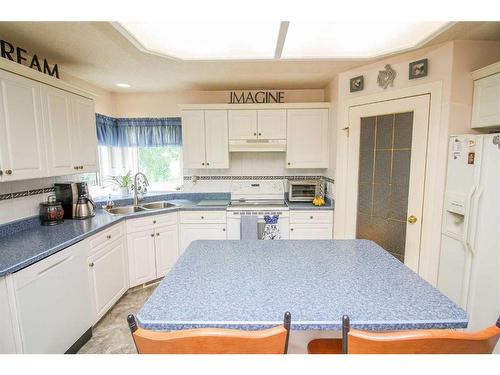 7509 102 Street, Grande Prairie, AB - Indoor Photo Showing Kitchen With Double Sink