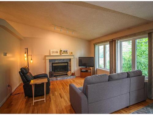 7509 102 Street, Grande Prairie, AB - Indoor Photo Showing Living Room With Fireplace