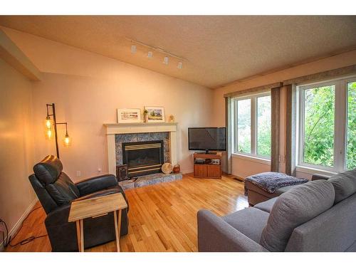 7509 102 Street, Grande Prairie, AB - Indoor Photo Showing Living Room With Fireplace