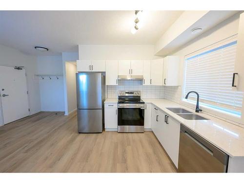 10101 105 Avenue, Grande Prairie, AB - Indoor Photo Showing Kitchen With Stainless Steel Kitchen With Double Sink With Upgraded Kitchen