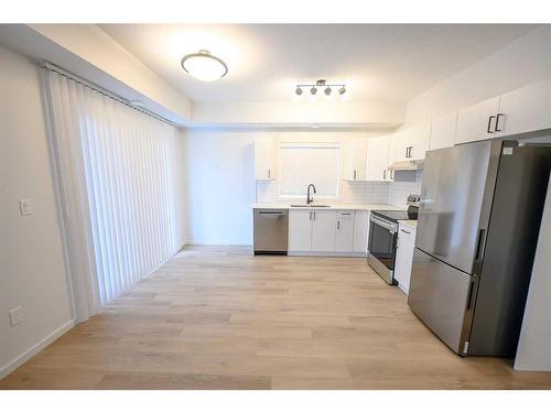 10101 105 Avenue, Grande Prairie, AB - Indoor Photo Showing Kitchen With Stainless Steel Kitchen