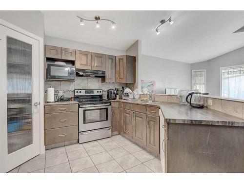 9422 88 Street, Grande Prairie, AB - Indoor Photo Showing Kitchen With Double Sink