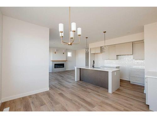 8222 87A Street, Grande Prairie, AB - Indoor Photo Showing Kitchen With Fireplace