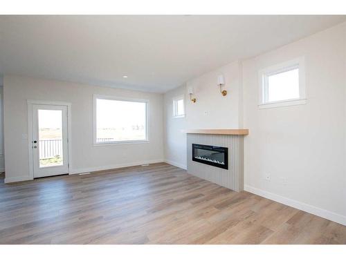 8222 87A Street, Grande Prairie, AB - Indoor Photo Showing Living Room With Fireplace