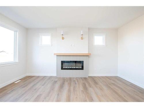 8222 87A Street, Grande Prairie, AB - Indoor Photo Showing Living Room With Fireplace