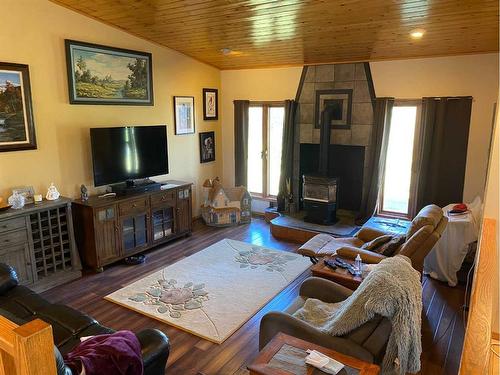 8080 Twp Rd 820, Rural Saddle Hills County, AB - Indoor Photo Showing Living Room With Fireplace