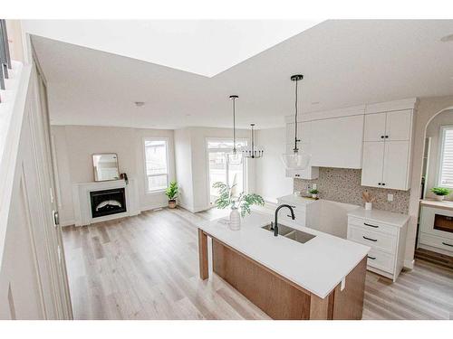 9805 89A Street, Grande Prairie, AB - Indoor Photo Showing Kitchen With Fireplace With Upgraded Kitchen