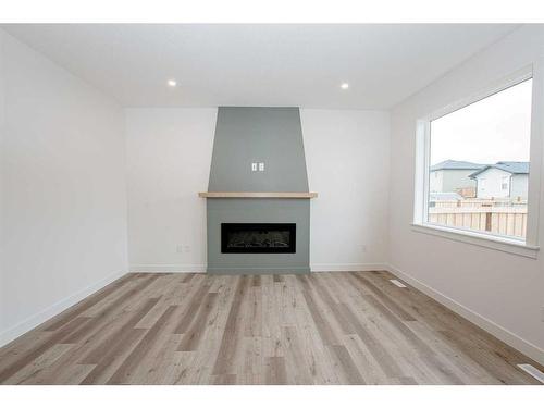 9702 89 Street, Grande Prairie, AB - Indoor Photo Showing Living Room With Fireplace