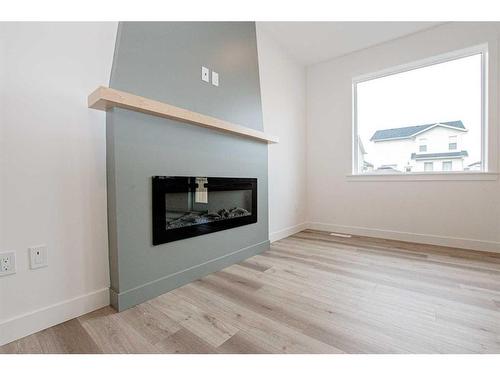 9702 89 Street, Grande Prairie, AB - Indoor Photo Showing Living Room With Fireplace