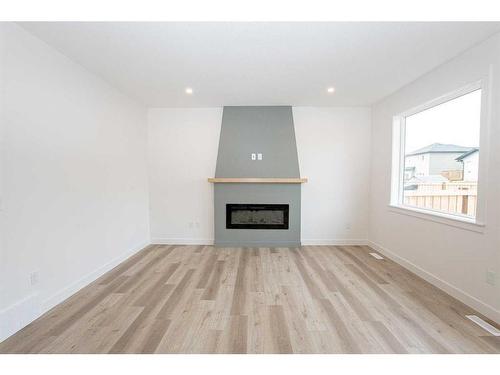 9702 89 Street, Grande Prairie, AB - Indoor Photo Showing Living Room With Fireplace