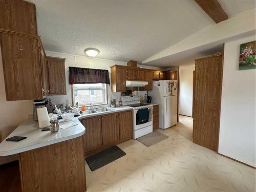 47 Huston Drive, Grimshaw, AB - Indoor Photo Showing Kitchen With Double Sink