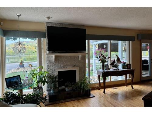 10603 99 Street, Peace River, AB - Indoor Photo Showing Living Room With Fireplace