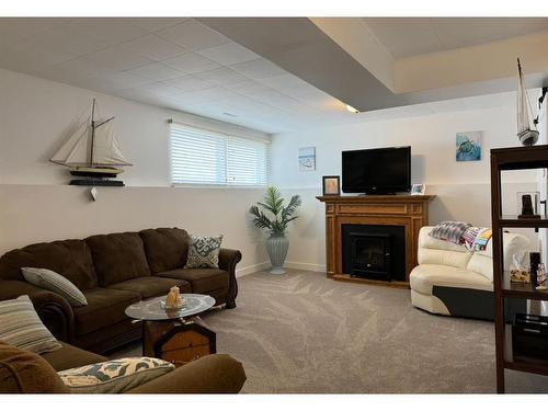 10603 99 Street, Peace River, AB - Indoor Photo Showing Living Room With Fireplace