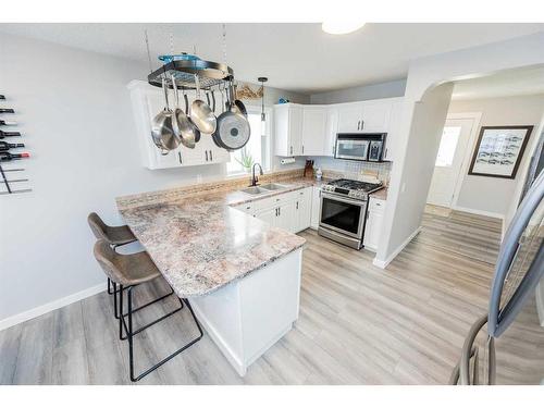 12012 Crystal Lake Drive, Grande Prairie, AB - Indoor Photo Showing Kitchen With Stainless Steel Kitchen With Double Sink