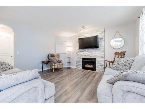 12012 Crystal Lake Drive, Grande Prairie, AB - Indoor Photo Showing Living Room With Fireplace