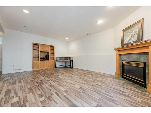 9009 117 Avenue, Grande Prairie, AB - Indoor Photo Showing Living Room With Fireplace