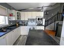 8837 106 Avenue, Grande Prairie, AB  - Indoor Photo Showing Kitchen With Double Sink 