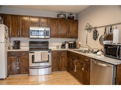 10513 106 Street, High Level, AB - Indoor Photo Showing Kitchen With Double Sink