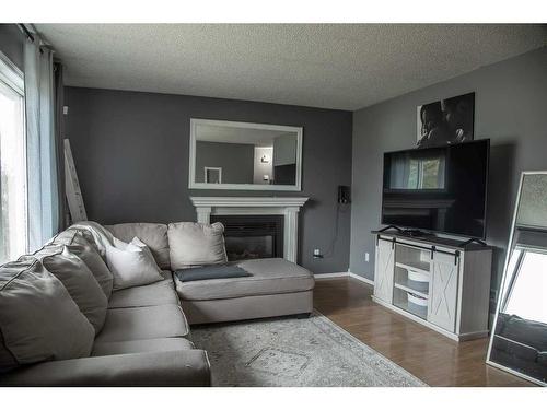 10513 106 Street, High Level, AB - Indoor Photo Showing Living Room With Fireplace