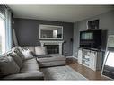 10513 106 Street, High Level, AB  - Indoor Photo Showing Living Room With Fireplace 