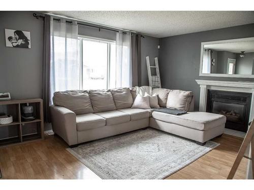 10513 106 Street, High Level, AB - Indoor Photo Showing Living Room With Fireplace