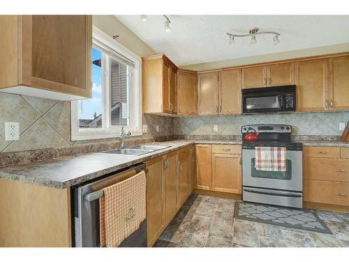 8603 103 Avenue, Grande Prairie, AB - Indoor Photo Showing Kitchen With Double Sink