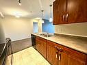 111-9120 96 Avenue, Grande Prairie, AB  - Indoor Photo Showing Kitchen With Double Sink 