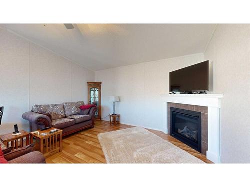 11205 97 Street, Clairmont, AB - Indoor Photo Showing Living Room With Fireplace