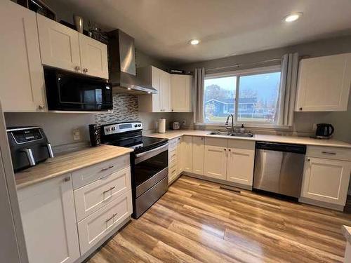 10015 100 Street, High Level, AB - Indoor Photo Showing Kitchen With Stainless Steel Kitchen With Double Sink