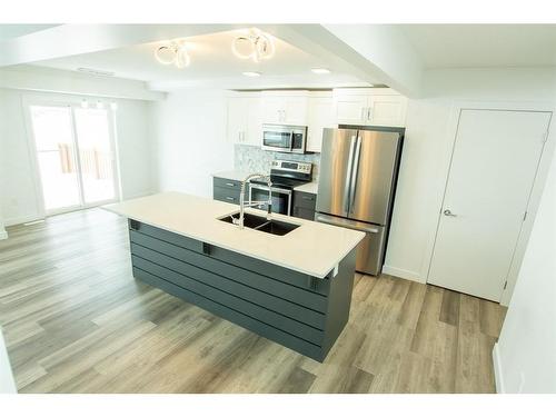 8845 85A Avenue, Grande Prairie, AB - Indoor Photo Showing Kitchen With Double Sink