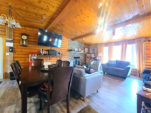 863036 Range Road 242, Rural Northern Lights, County Of, AB - Indoor Photo Showing Living Room With Fireplace